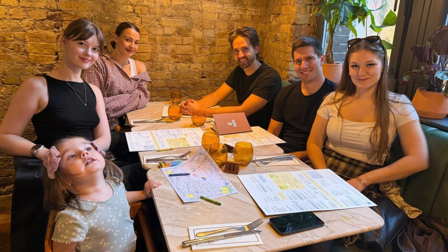 Magebit team at a restaurant dinner in London discussing strategy for eCommerce Expo 2026