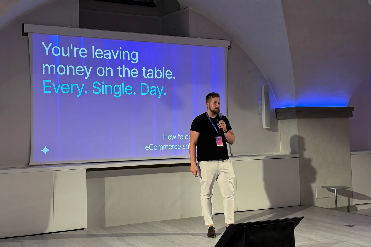 Rihards Ratke of Magebit presenting on the main stage at Meet Magento Italy 2026