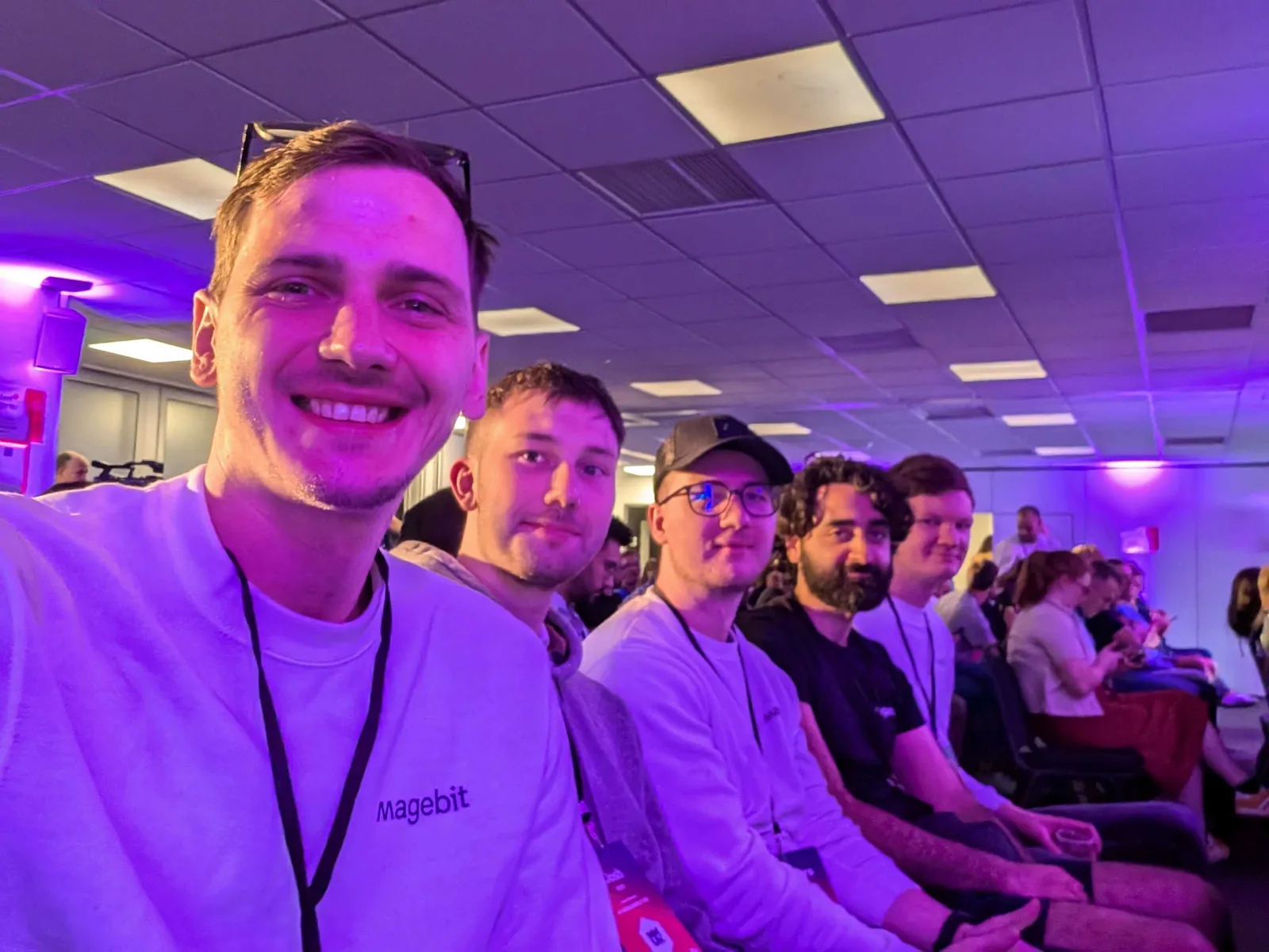 Magebit team in the audience of a session at Meet Magento UK 2024