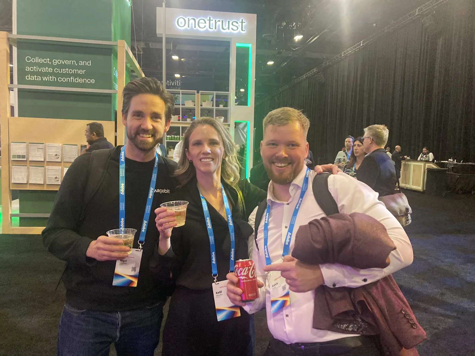 Nigel Leadbitter and Kalvis Ceizins of Magebit with another attendee on the Adobe Summit 2025 expo floor