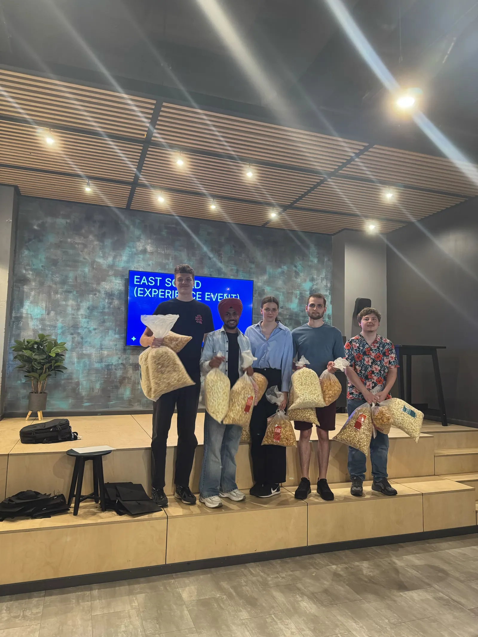 Bootcamp participants lined up on stage at the Magebit Bootcamp 2025 closing