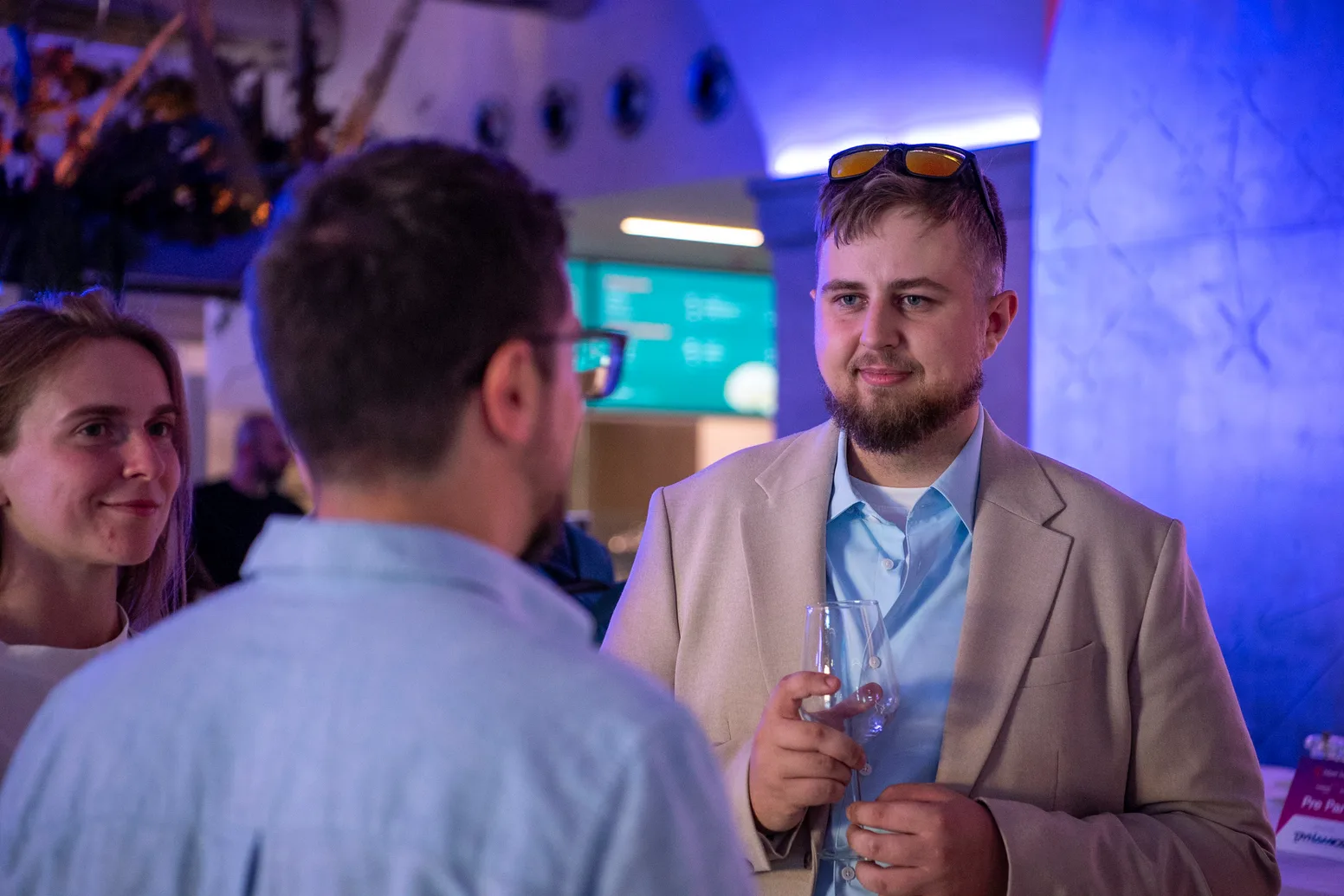 Attendees talking over drinks at the Meet Magento Italy 2026 evening reception