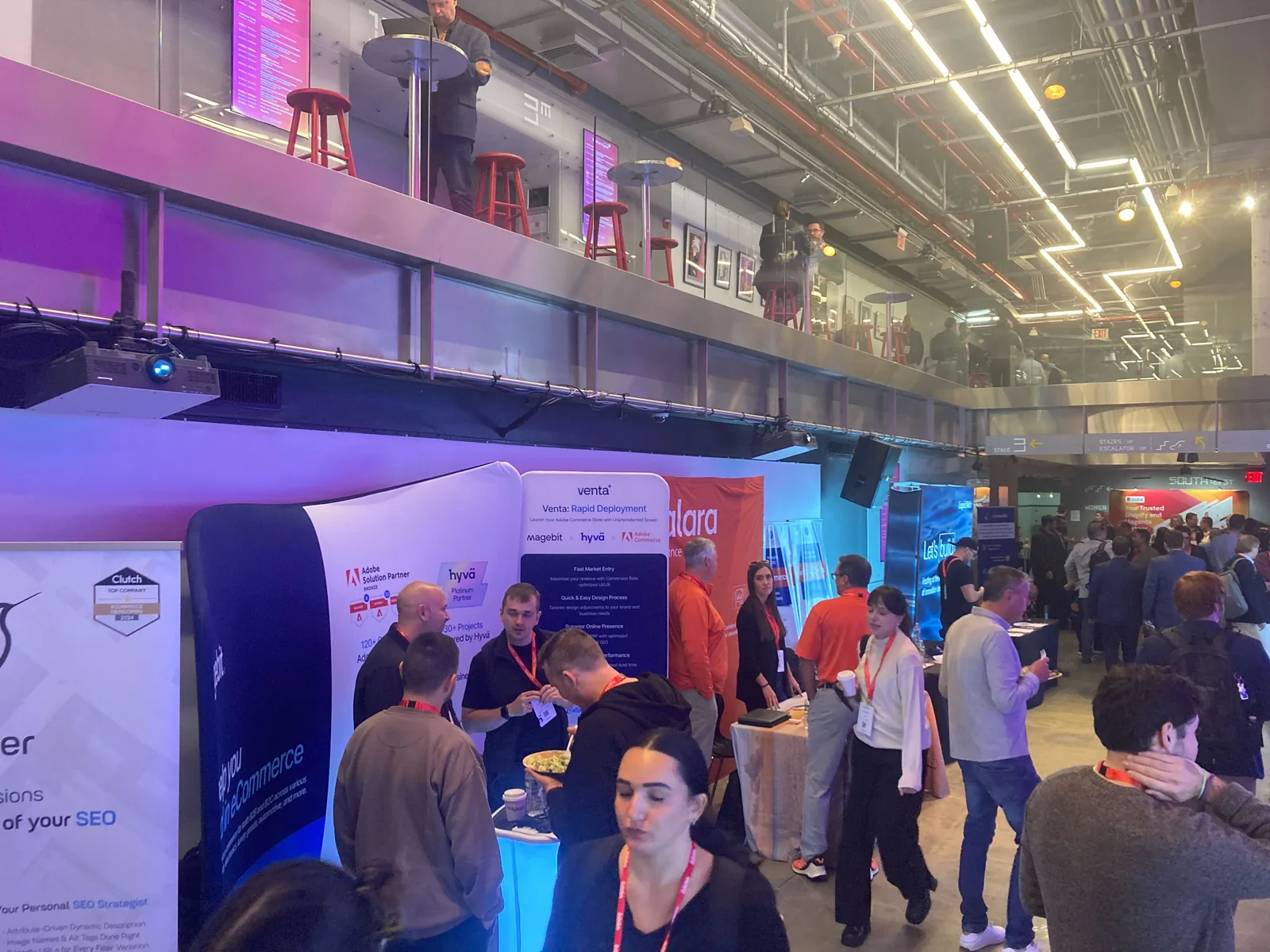 Attendees around the Magebit and Venta booth at Meet Magento New York 2024