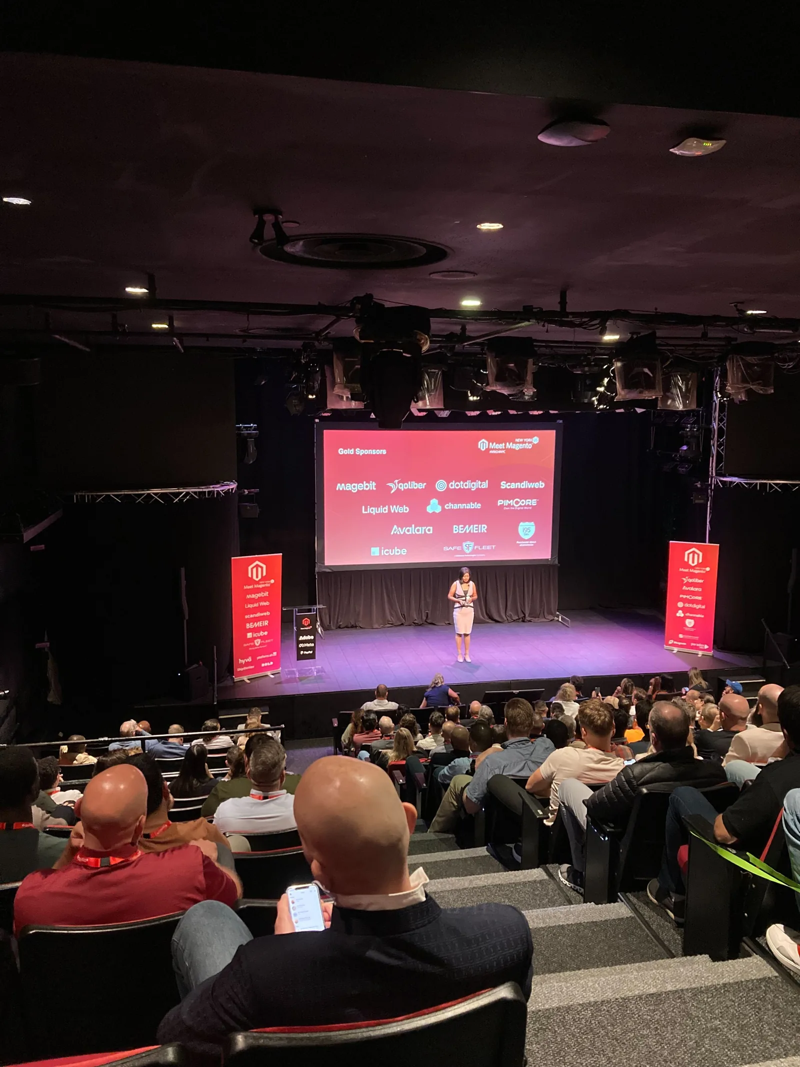 Main stage at New World Stages showing the sponsor slide with the Magebit logo at Meet Magento New York 2024