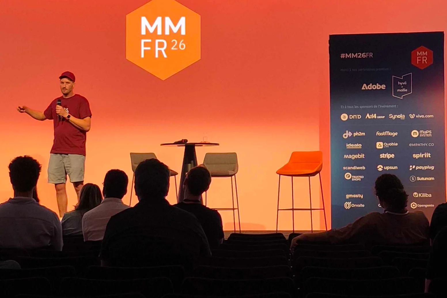A speaker on the main stage at Meet Magento France 2026