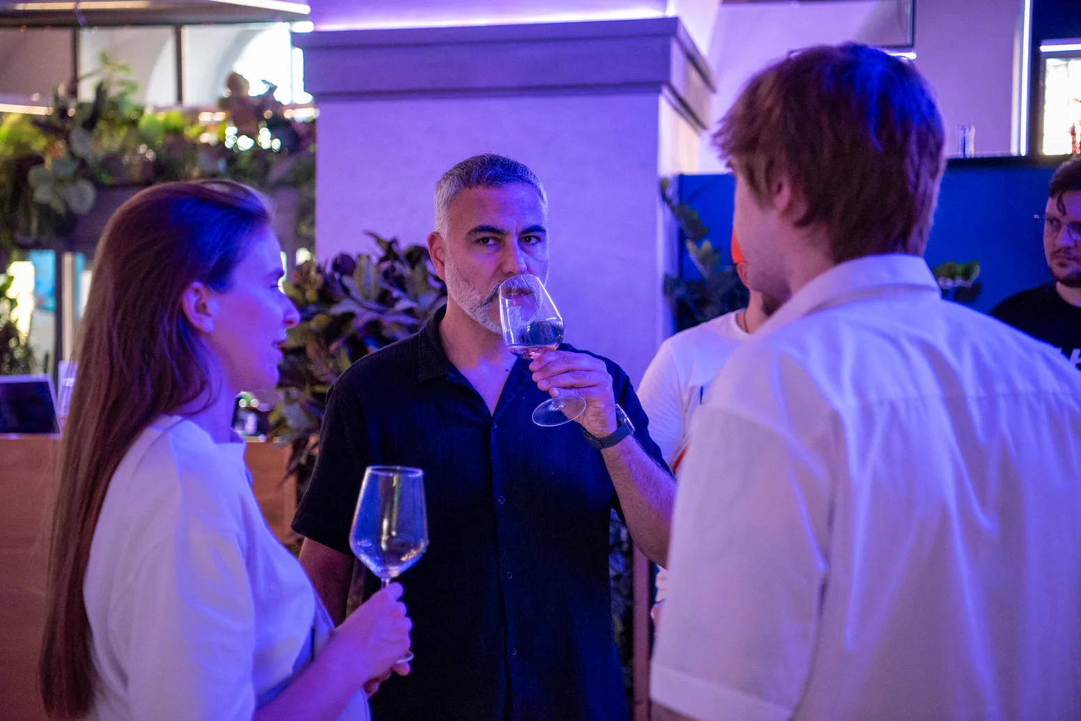 Attendees networking over a glass of wine at Meet Magento Italy 2026