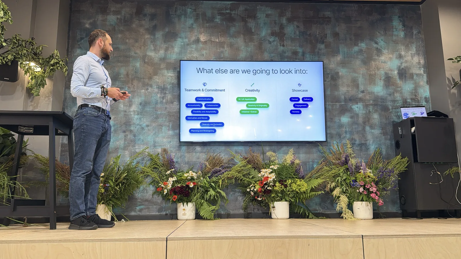 A Magebit host speaking on stage before the bootcamp awards