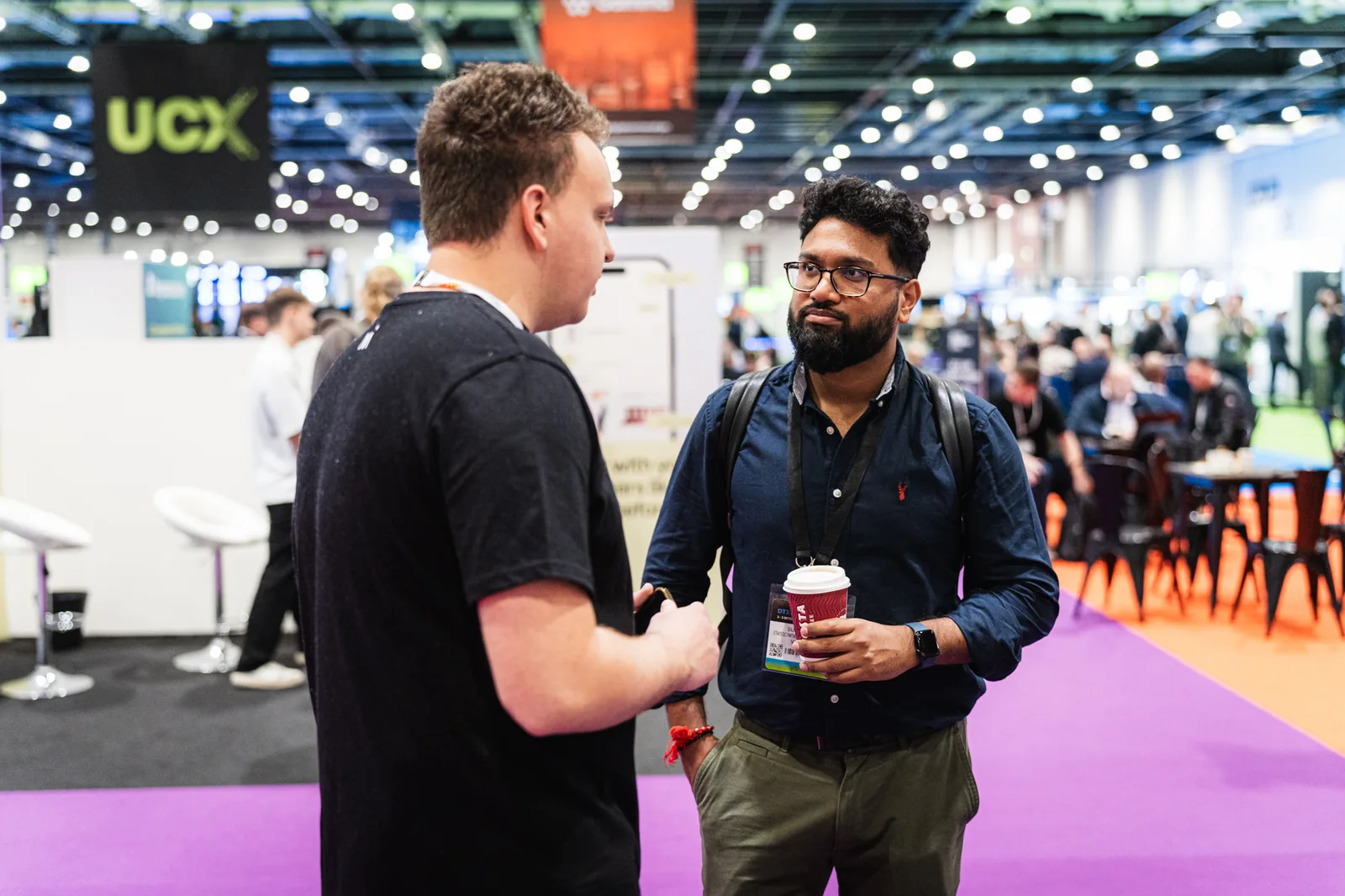Magebit team member networking on the show floor at Digital Commerce Expo 2024