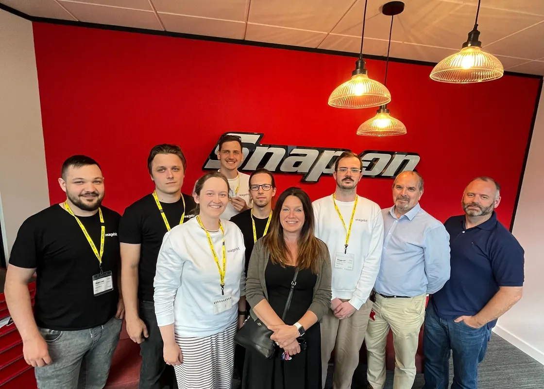 Magebit team with Snap-on Business Solutions in their office.